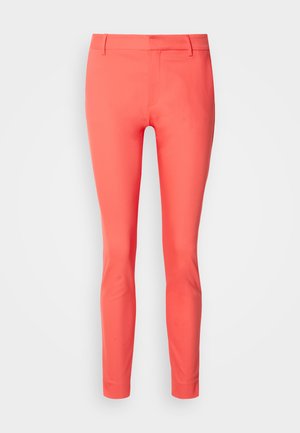 Coral slim-fit trousers made of smooth fabric, featuring a zip fly, belt loops, and a sleek design without pockets.