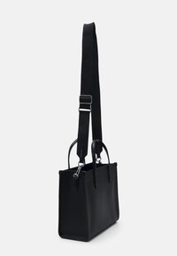 Black leather handbag with a textured finish, dual top handles, and an adjustable strap. Features silver-tone hardware and a structured shape.