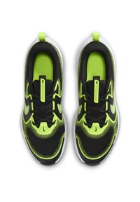 Black and neon green athletic shoes with mesh upper, round toe, contrasting white sole, and black laces; features logo detail on the side.