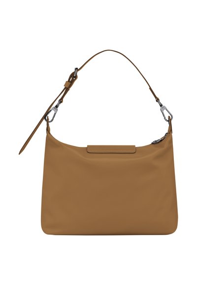 Tan leather handbag with a soft, smooth texture. Features a single shoulder strap, a magnetic closure, and subtle stitching details.