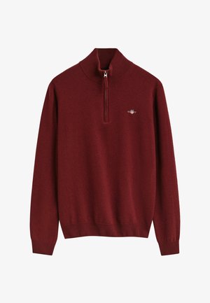 Bordeaux zip-necksweater gemaakt van zachte gebreide stof, met een geribbelde zoom en mouwen, voorzien van een klein geborduurd logo op de borst.