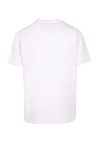 Hvit bomulls T-skjorte med korte ermer, rund hals og en avslappet passform. Minimalistisk design med en jevn tekstur og uten synlige mønstre.