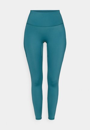 Teal high-waisted leggings made from stretchy material, featuring a smooth texture and a fitted design with no visible hardware.