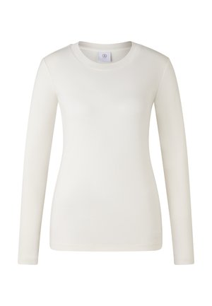 T-Shirt ajusté à manches longues pour femmes, de couleur blanc cassé unie, avec une petite étiquette de marque discrète à l'intérieur du col.