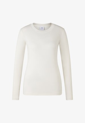 Women’s long-sleeve, fitted crew neck shirt in solid off-white color with a subtle brand tag inside the collar.