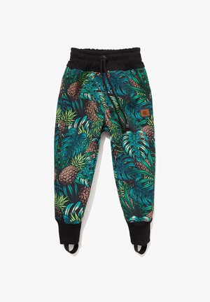 Dziecięce spodnie dresowe z tropikalnym nadrukiem ananasów i dużych turkusowych liści, czarna elastyczna talia, mankiety i paski na stopy.