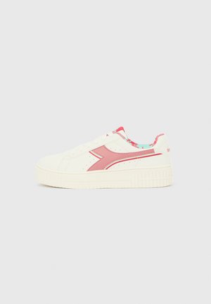 White sneaker with a pink side logo, featuring a textured platform sole, lace-up closure, and a colorful patterned interior lining.