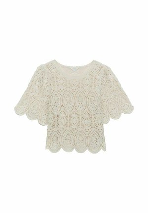 Spetsblus i off-white med scallopade kanter, featuring blommönster och korta, puffiga ärmar. Lätt, strukturerad tyg.