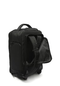 Black rolling backpack with padded straps, side zip pocket, top handle, and rear compartment unzipped to reveal straps and wheels.