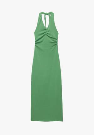 Green halter neck dress made of stretchy fabric, featuring gathered details at the bust and a sleek, form-fitting silhouette.