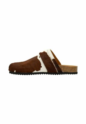 Brown and white cowhide slip-on clog with a textured surface, cork sole, and a low rounded heel, featuring an asymmetrical design.