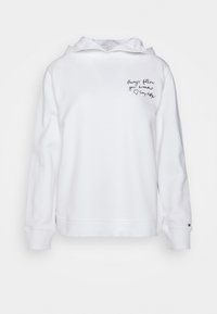 Hoodie en coton blanc avec une poche kangourou à l'avant, des manches longues et un message brodé sur la poitrine gauche en lettres cursives noires.