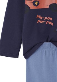 Navy blue long-sleeve top with orange truck graphic and "pin-pon pin-pon" text paired with light blue elastic waistband pants.