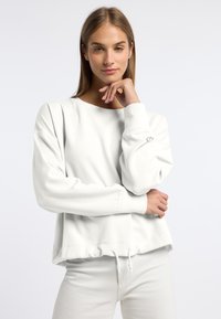 Witte sweatshirt met een relaxte pasvorm, verlaagde schouders en geribbelde cuffs. Voorzien van een verstelbare trekkoordonderkant en een klein logo op de mouw.