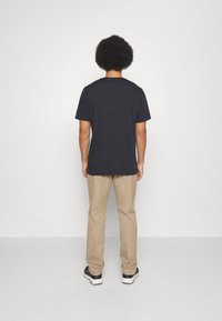 TravisMathew OPEN TO CLOSE - Trousers - khaki