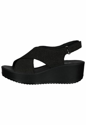 Sandali wedge neri con tomaia in tessuto texture, dotati di cinturini incrociati e cinturino alla caviglia posteriore. Suola texturizzata per una migliore aderenza.