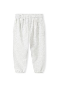 Ljusgrå sweatpants i mjukt tyg, med elastisk midja och samlade mudd vid anklarna. Slät yta med minimal detaljering.