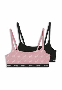 Twee bralettes in roze met herhalend "Hugo" logo patroon en zwart, beide met dunne bandjes en een zwarte elastische band met witte "Hugo" branding.