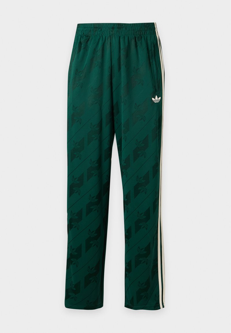 Dunkelgrüne Sporthose mit dezenten gemusterten Logos, weißen Seitenstreifen, elastischem Bund und kleinem weißen Adidas Trefoil-Logo am rechten Oberschenkel.