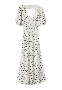 Robe à pois en crème, avec des pois noirs, des manches courtes bouffantes, un décolleté en V et une silhouette fluide en A.