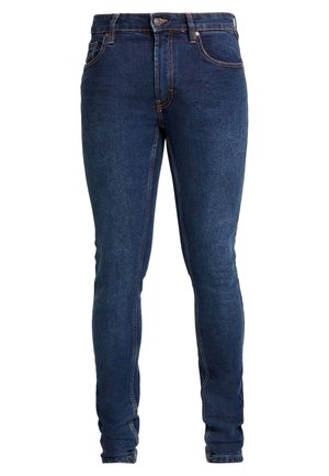 Mørkeblå denimjeans med slim fit, fem lommer og kontrasterende orange syninger. Har en knaplukning og bæltestropper.