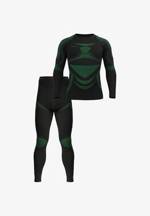 Black athletic compression top and leggings with green geometric patterns and textured accents. Smooth fabric with long sleeves and a fitted design.