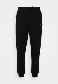 Jordan Pantaloni de trening - black/white