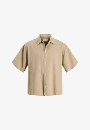 Chemise beige à manches courtes avec boutons, tissu texturé et col classique, présentée sur fond blanc.