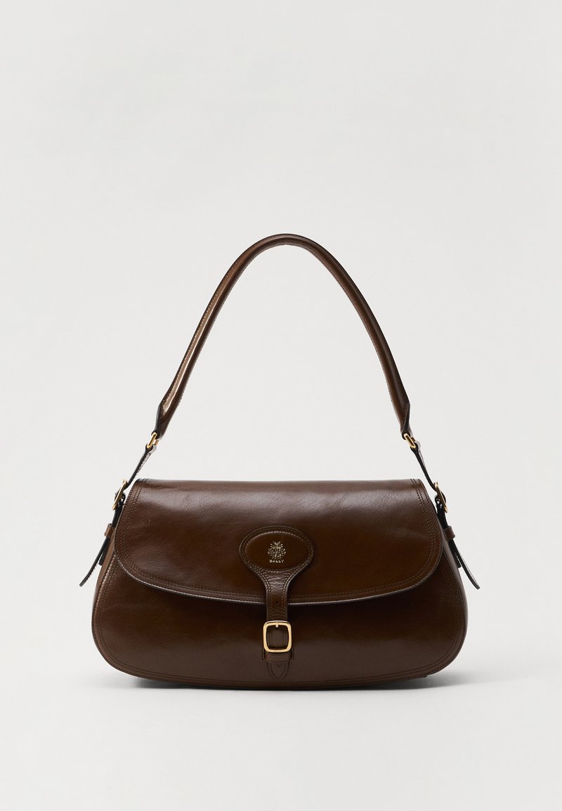 Brown leather handbag with a rounded shape, flap closure, a gold-tone buckle, and a textured strap. Features an embossed logo detail.