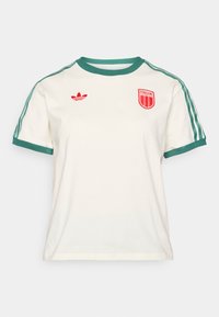 White cotton t-shirt with green accents on sleeves and collar, featuring a red "Adidas" logo and an embroidered red circular "Italia" badge.