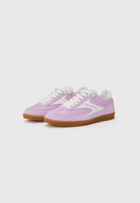 Purple suede sneakers with white accents and laces, featuring a low profile and a textured rubber sole. "Karl Lagerfeld" printed on the side.