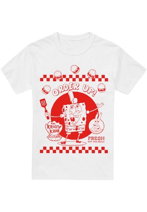 White t-shirt featuring red graphic design of a cartoon character with a spatula, text "ORDER UP!", and checkered pattern.