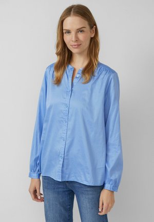 Hellblaues Hemd mit Knopfleiste aus glattem Stoff, mit Kragen, langen Ärmeln mit elastischen Bündchen und einem lockeren Schnitt.