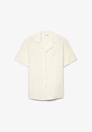 Camicia a maniche corte color avorio con bottoni, collo alla coreana e tessuto testurizzato, mostrata distesa su uno sfondo bianco.