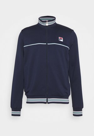 Giacca sportiva con zip blu marina in tessuto morbido con colletto alto, strisce bianche e azzurro chiaro su polsini e orlo, con un piccolo logo.