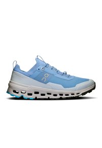 Light blue athletic shoes with a breathable mesh upper, white cushioning sole, and distinctive cutouts; features a rounded toe and lacing system.