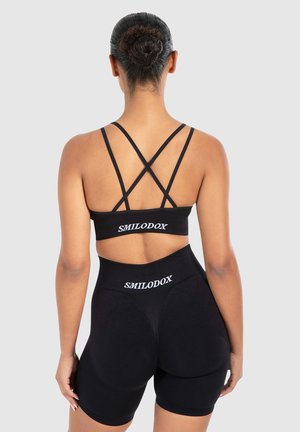 KATRIN CROSS STRAPBACK BH - Light support sports bra - schwarz