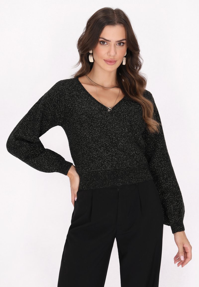 Maglione nero scintillante con scollatura a V, maniche lunghe a sbuffo, vita aderente e polsini a costine. Vestibilità standard, realizzato in tessuto morbido e texture.