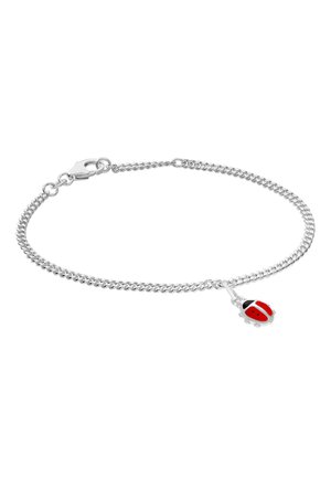 Silver chain bracelet with lobster clasp and small red and black ladybug charm dangling near the clasp.
