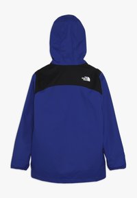 Giacca blu con una parte superiore nera e cappuccio. Presenta un tessuto morbido, polsini elasticizzati e il logo del marchio sul retro.