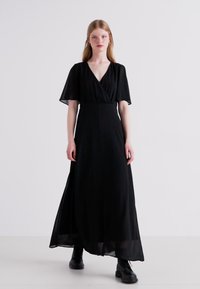 Black maxi dress with short flutter sleeves, a V-neckline, and a flowing silhouette. Made from lightweight fabric with a smooth texture.