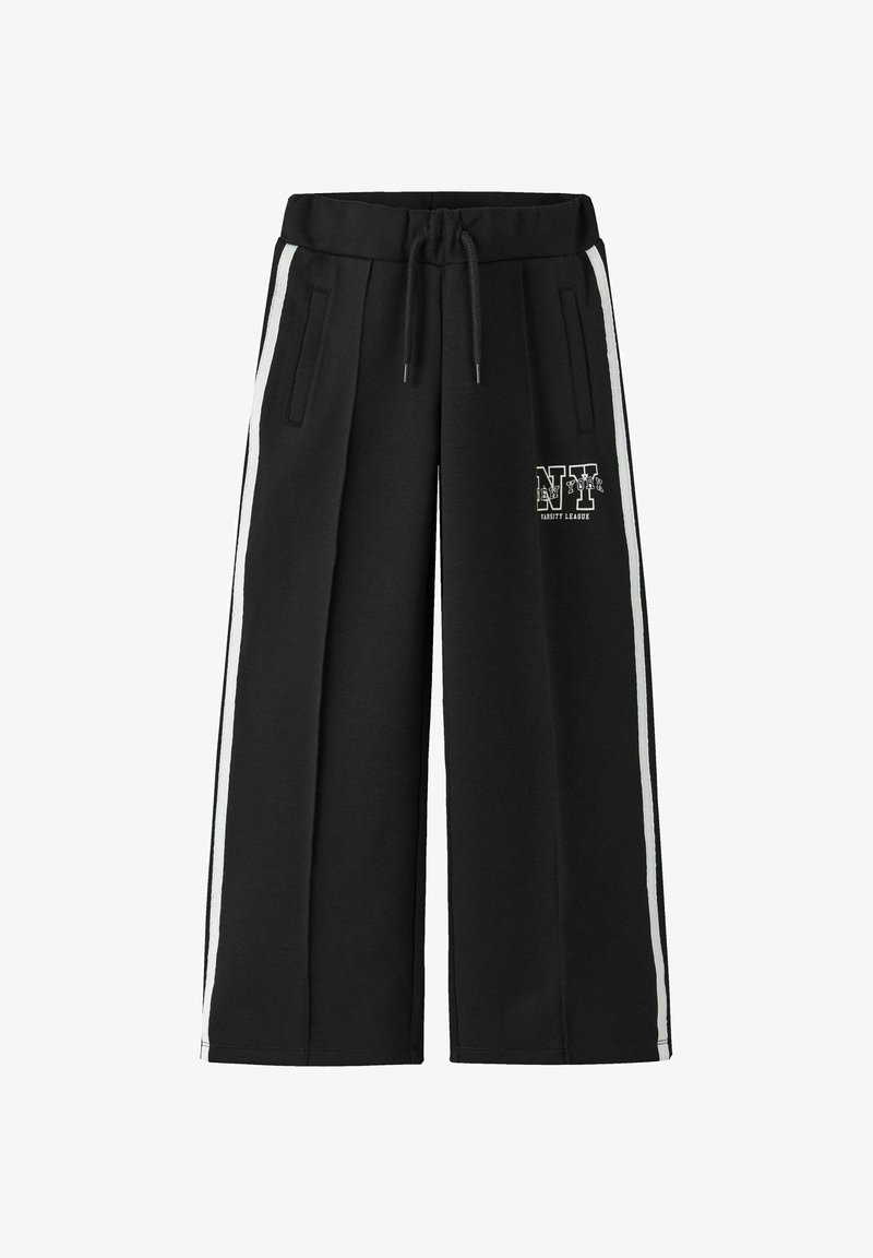 Melni platā griezuma sporta bikses ar baltām sānu svītrām, ar aukliņu jostu un priekšējām kabatām. Ieskaitot tekstu "NY Varsity League".