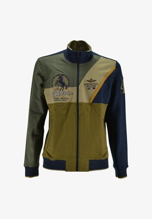 Giacca zip con colletto alto in khaki e navy. Presenta grafiche aviatore ricamate e un design a blocchi di colore. Realizzata in misto cotone.