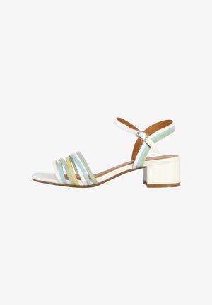 Strappy heel sandal in white, featuring pastel blue, green, and yellow accents. Block heel and ankle strap with adjustable buckle.