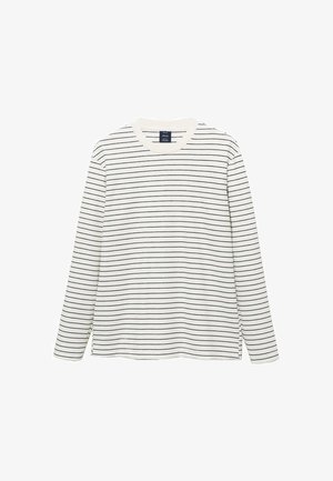 Långärmad bomullsskjorta i vitt tyg med tunna svarta horisontella ränder, rund halsringning och sprund vid fållen.