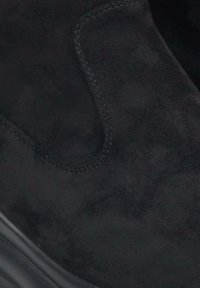 Black suede ankle boot with a smooth texture, elastic side panel, and a rounded toe. Features a durable black rubber sole.
