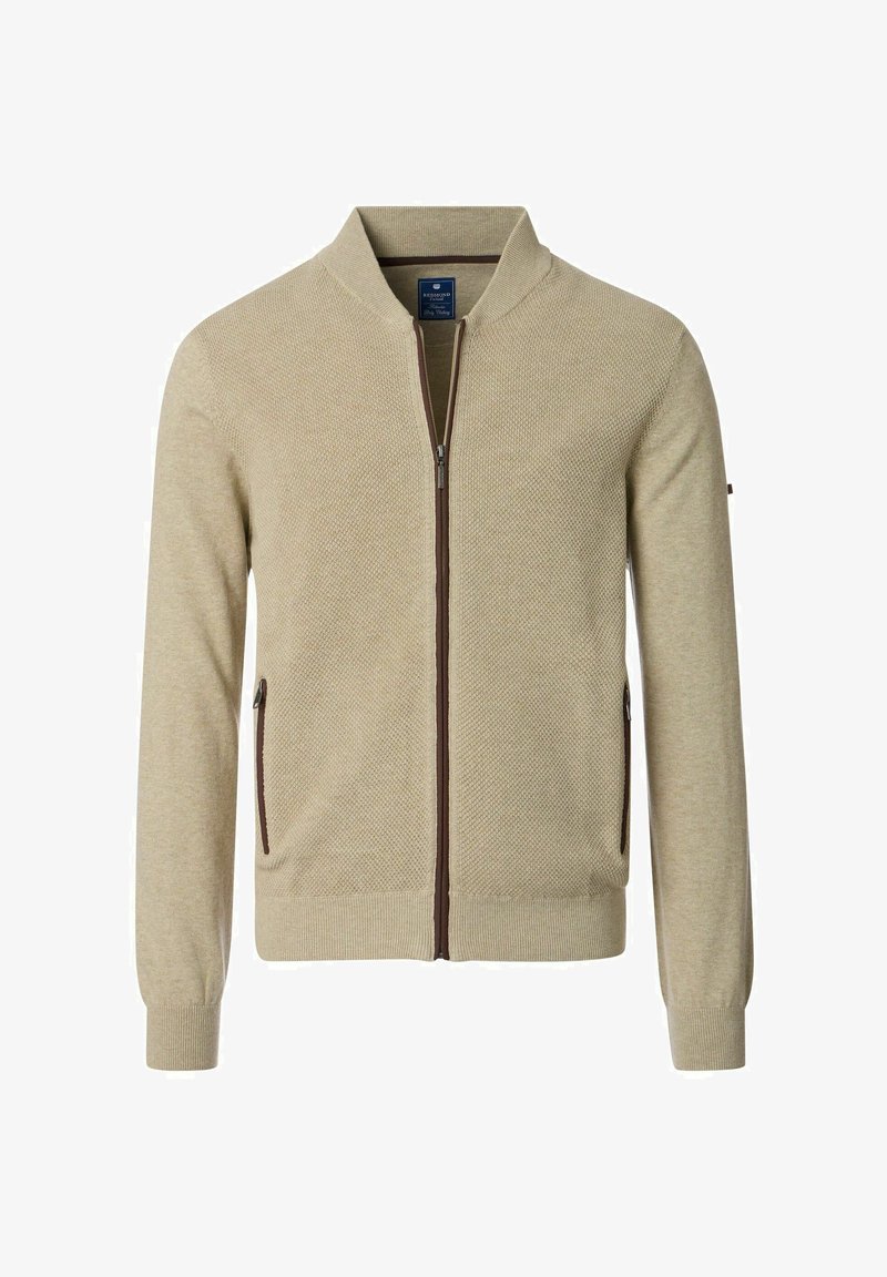 Beżowy kardigan na zamek wykonany z teksturowanej tkaniny, z dwoma bocznymi kieszeniami z brązowymi zamkami, prążkowanymi mankietami i kołnierzykiem stojącym.