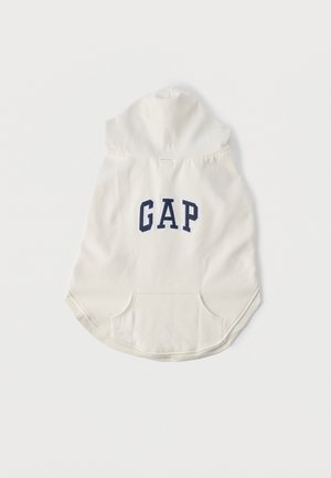 Licht crèmekleurige hoodie met een kangaroo zak aan de voorkant, een afgeronde zoom en een marineblauw "GAP" logo op de achterkant. Gemaakt van zacht materiaal.