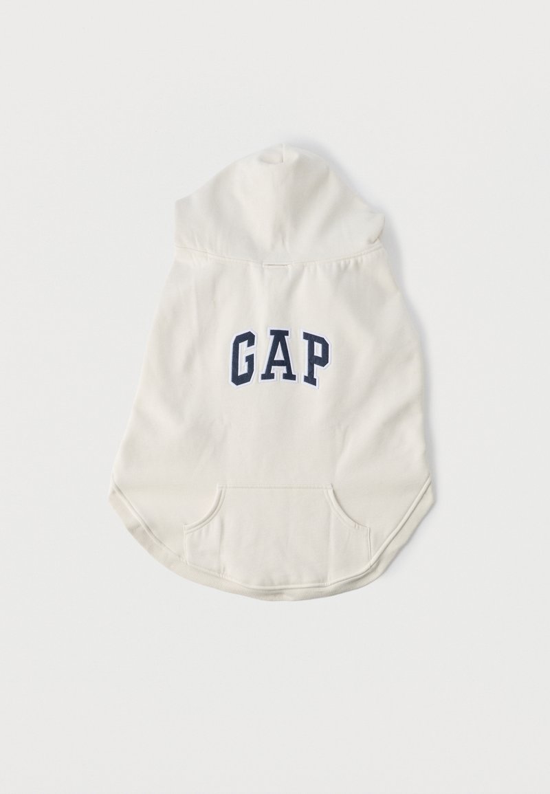 Šviesios kremų spalvos džemperis su gobtuvu, priekyje kanguros kišenė, apvalinta apačia ir tamsiai mėlyna "GAP" logotipu nugaroje. Pagamintas iš minkštos medžiagos.