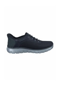 Black athletic shoe featuring a textured mesh upper, grey rubber sole with segmented cushioning, and laces for a secure fit.